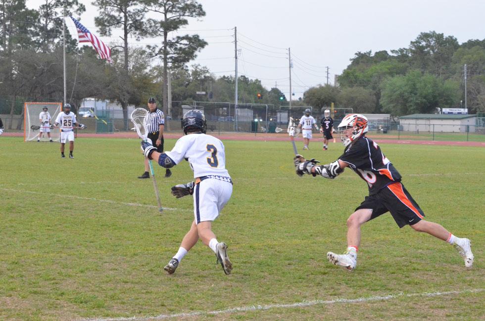 Brock Lilley competes in lacrosse.