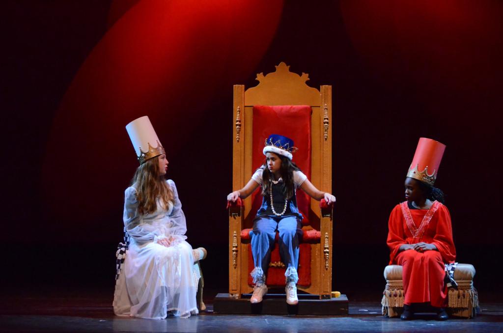 From left to right: Tegan Hosbein as the White Queen, Angela Alvarez as Alice, and Adede Appah-Sampong as the Red Queen