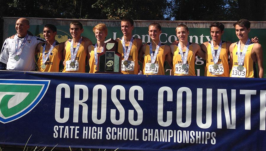 The+Trinity+Prep+Boys+Cross+Country+team+lined+up+together+to+receive+their+state+championship+trophy.