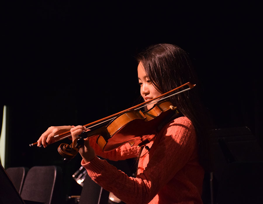 Park diligently plays her violin in a performance during chapel