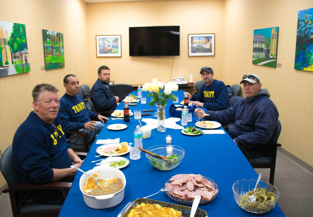 The Boys in Blue enjoy their luncheon held by the Trinity Parent’s Organization in the Miles Room.
