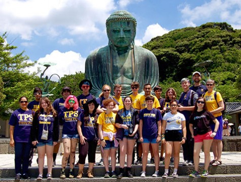 With their accomplishment, he explorers grin after reaching the Great Bhudda at Kamakura.