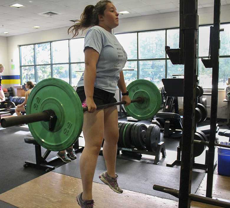 Senior captain Kerstin Heinrich practices her clean in preparation for the Girls Varsity Weightlifting season.