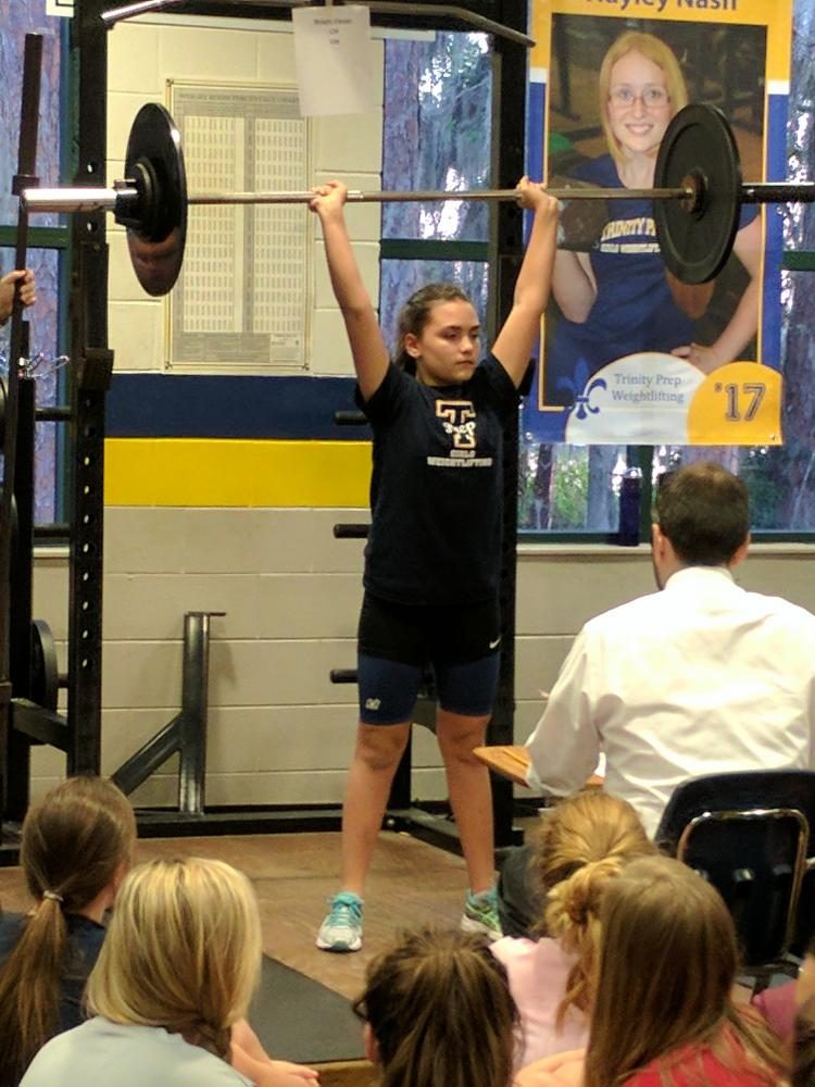 Ellie Watson lifts her way to victory in a home meet