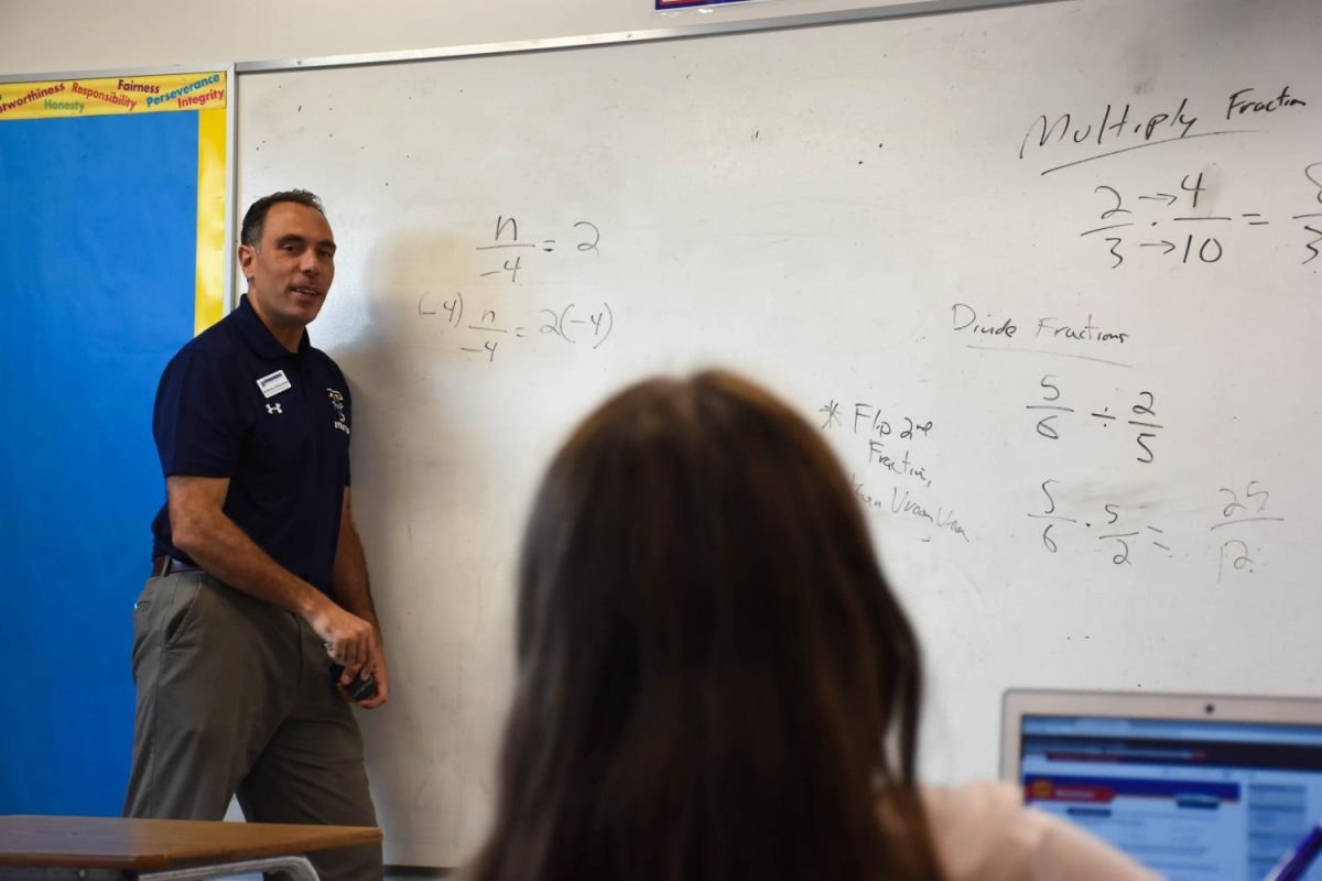 DiGiovanni teaches his students how to multiply and divide fractions. To ensure his students’ understanding, DiGiovanni tries to tie the problems to real-world situations.