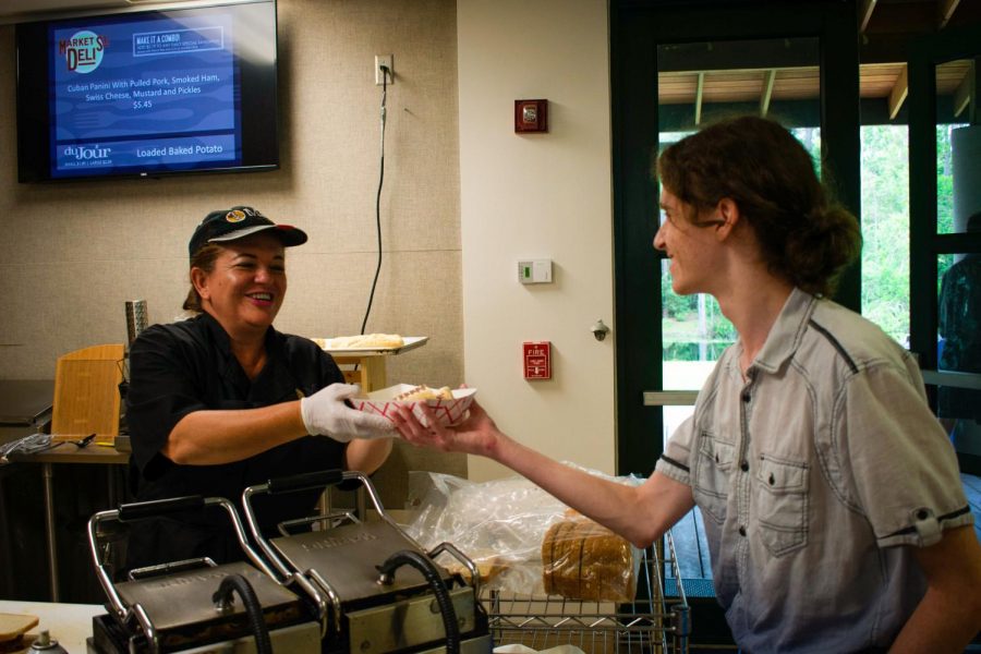 Senior Joshua Gerstein purchases a sandwich from the Grille that accommodates his food allergies.