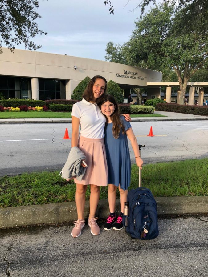 Sophomore Lea Kuehnel smiles for her first day of school with host sister, seventh grader Tori Martin.