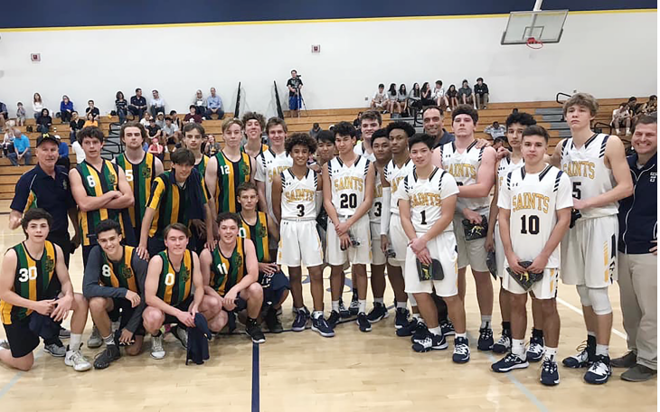 Trinity Prep and St. Kevins College from Melbourne, Australia pose for a picture after exchanging gifts prior to their game on Jan. 3, 2020.