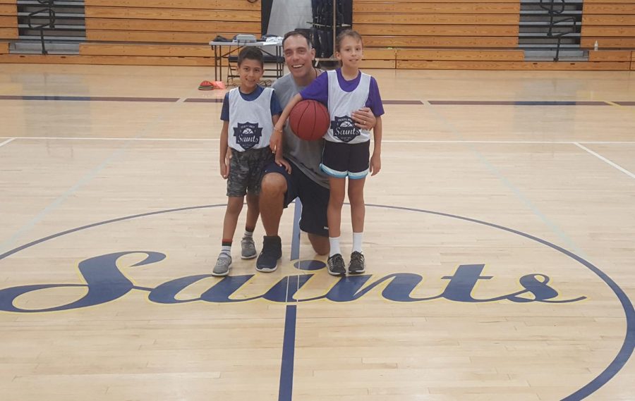 DiGiovanni posing with two of his children, Emma and Miles, during elementary school week at basketball camp.