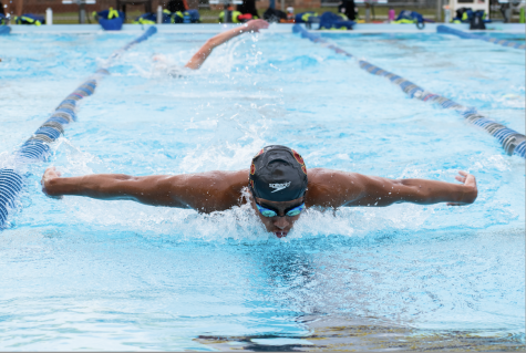 Junior Kevyn Collazo-Torres has contributed to the varsity swim teams continued success. During practice, he swims the butterfly stroke in preparation for the state meet. 