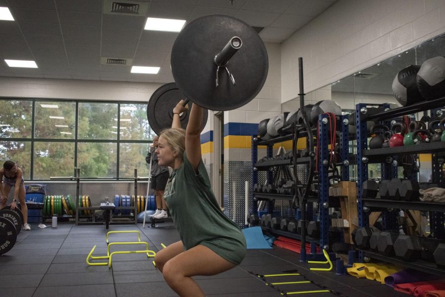 Senior weightlifter Alyssa Dorrien practices doing the new lift that has been added to girls weightlifting, called the snatch. 