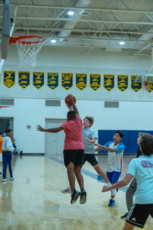 Seventh graders Alfonso Salvador, Carson Wicker and Avery Sasser compete in a basketball tournament. The tournament was for a fundraiser by eighth graders Ellison Clark and Gavin OBriens 20 Time project.