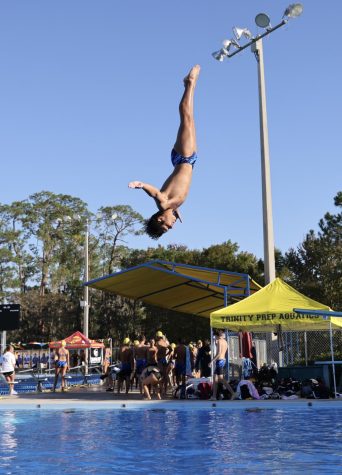 Nico Santiago performs a successful dive during senior night against Tampa Prep on October 6.