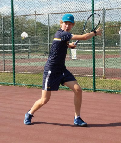 Freshman Ben Demetriades works on his forehand at a practice. Demetriades also trains outside of school by himself and with coaches. Demetriades is 8-0 so far this season.