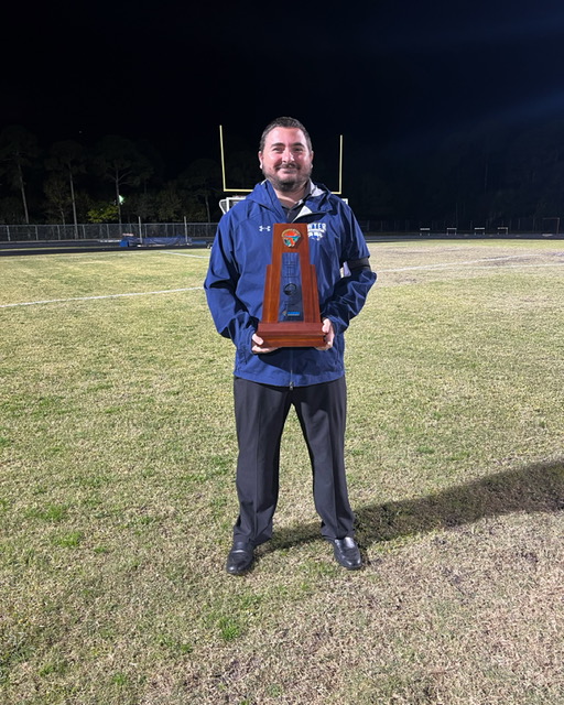 Lehman wins the district championship while coaching the William T. Dwyer Varsity Girls Soccer Team in the Spring of 2022. 