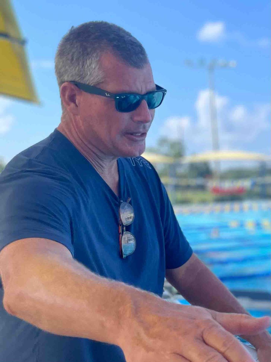 Lazaraton coaching at a swim meet held at Trinity on August 24th. 