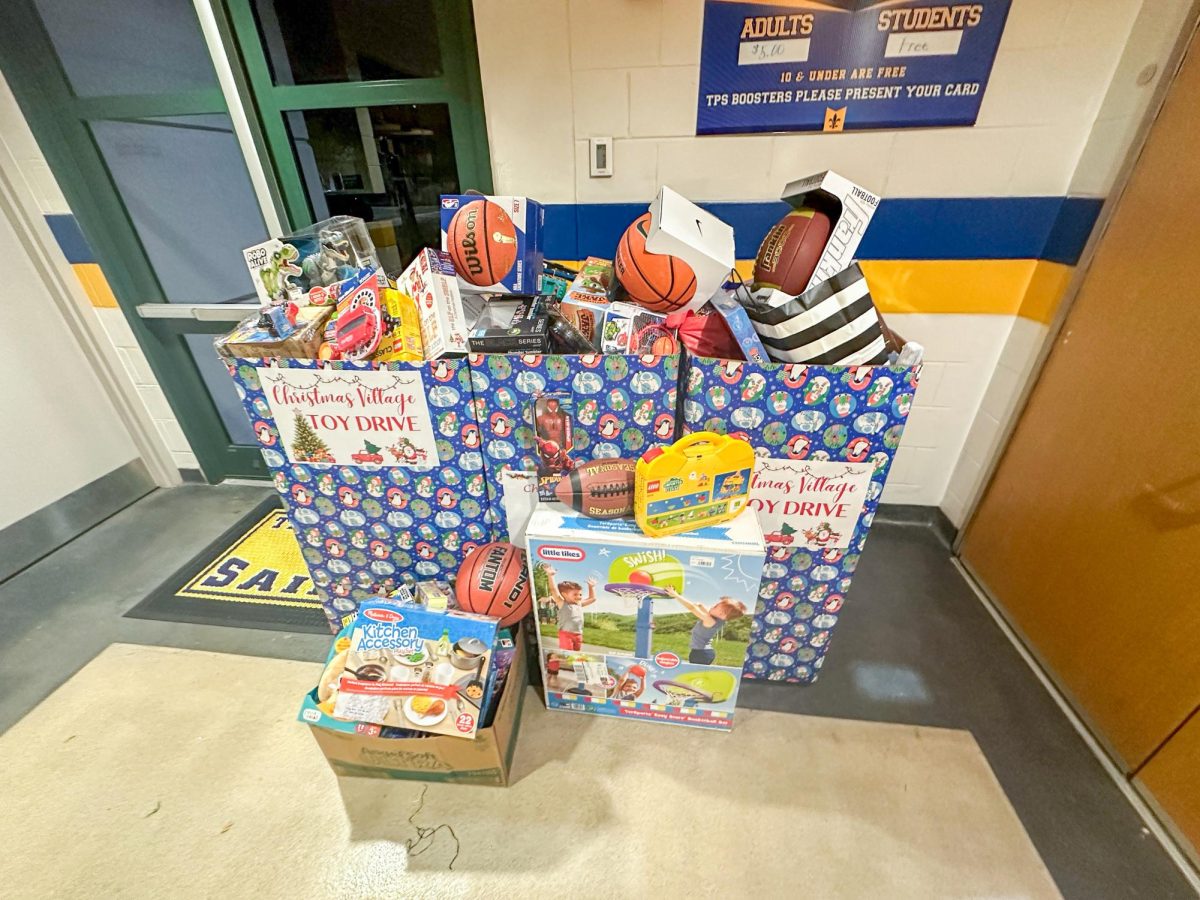 Students donate toys as attendance fee for Silent Night basketball.