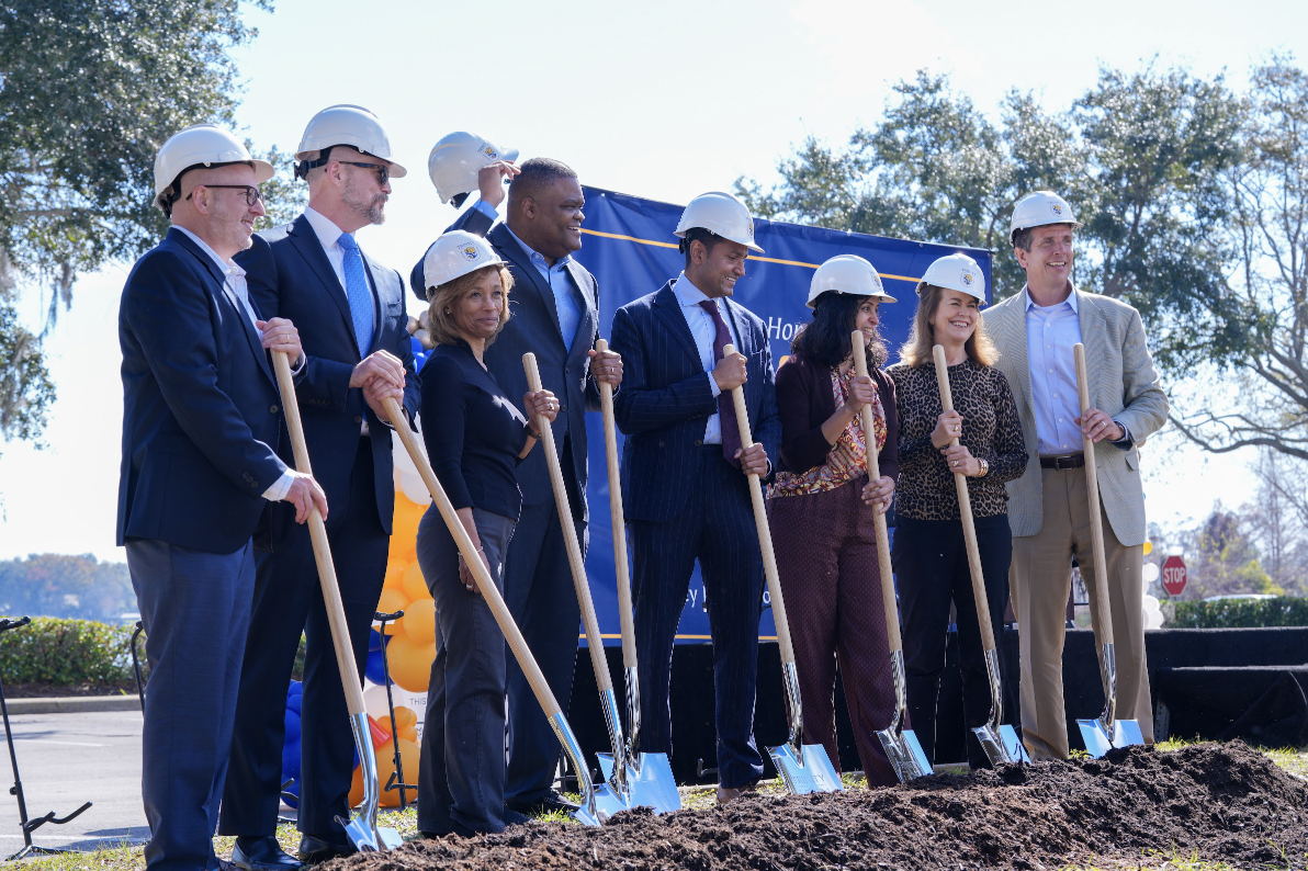 Three Board of Directors members, Head of School Byron Lawson, main donors and two members of the development office ceremoniously hold shovels in anticipation for the Nochur Sankar Science Center groundbreaking.