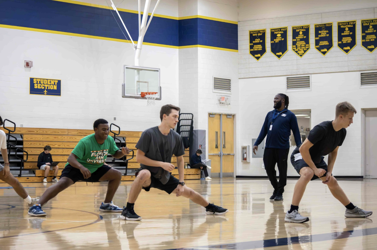 Chaz Williams runs drills with his students in strength and conditioning class.