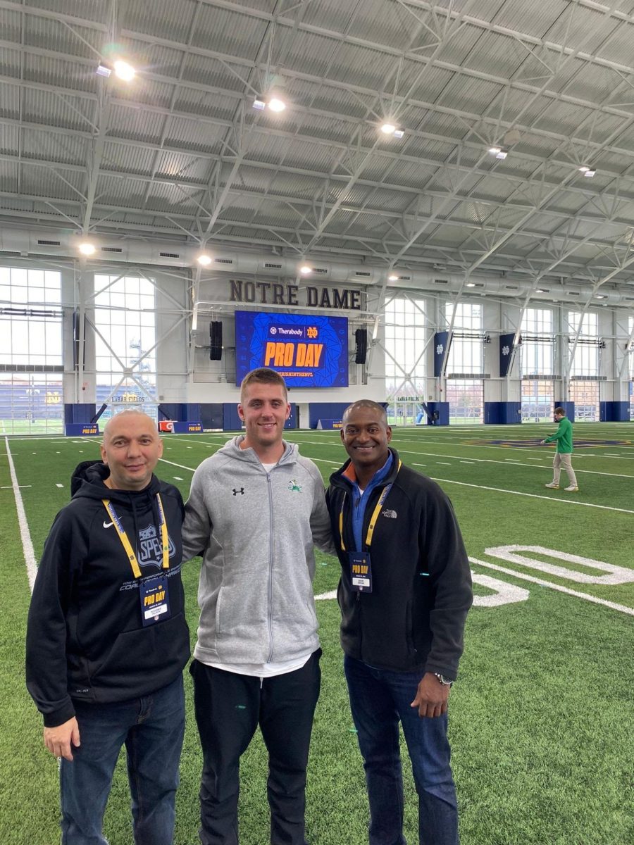 At the initial stage of the professional procedure, known as pro day, Andre Kirwan is photographed with his co-agent and Notre Dame quarterback Jack Coan.