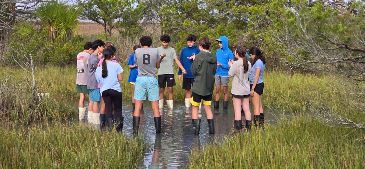 Students at the 4H Center at Tybee Island participate in a mud walk activity.

