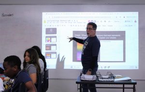 Kyle Schlett teaching his sixth grade students how to uniquely analyze images. Now, he will be moving to Egypt to continue teaching English there in a once-in-a-lifetime opportunity.