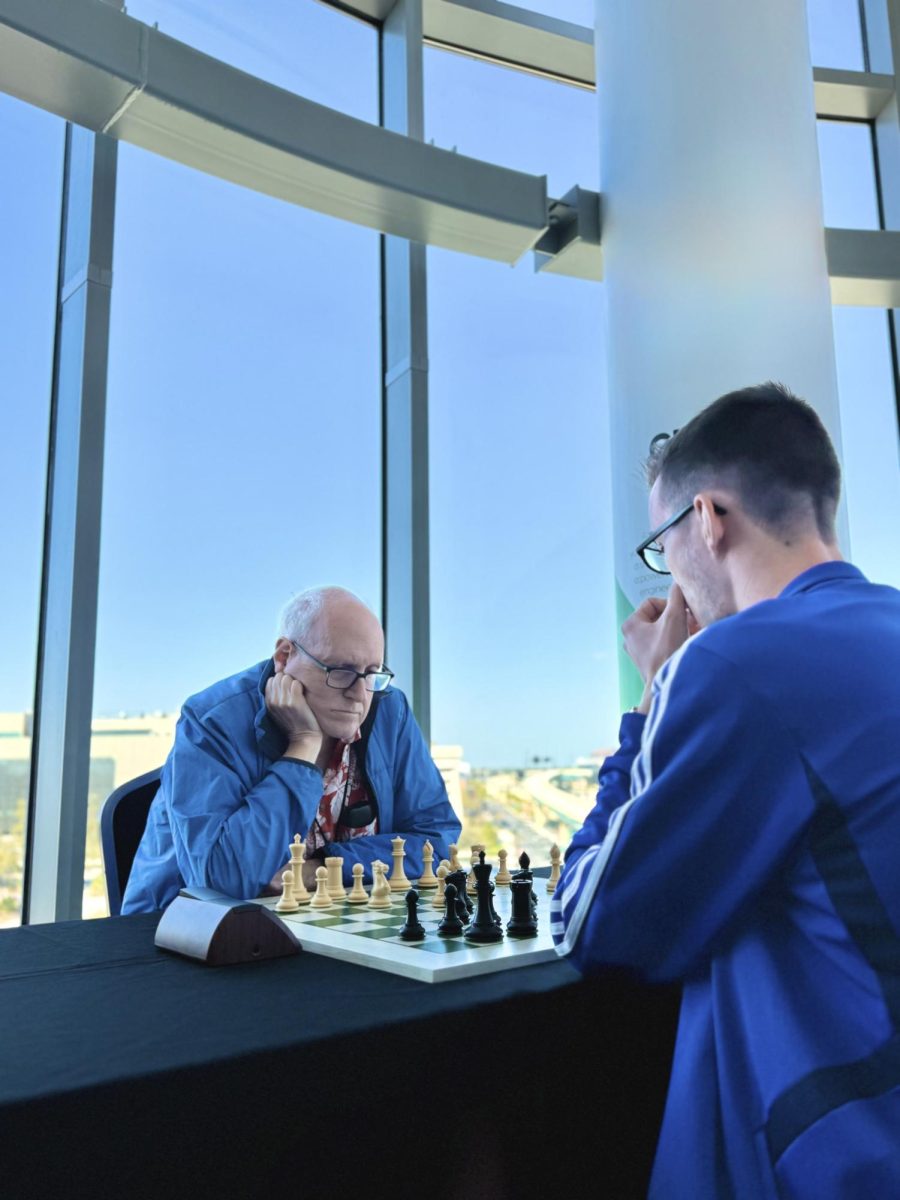 Larry Kaufman (left) plays Life Master Theo Slade (right) at the March 2025 Orlando Magic Championship.
Photo by Larry Kaufman, used with permission.