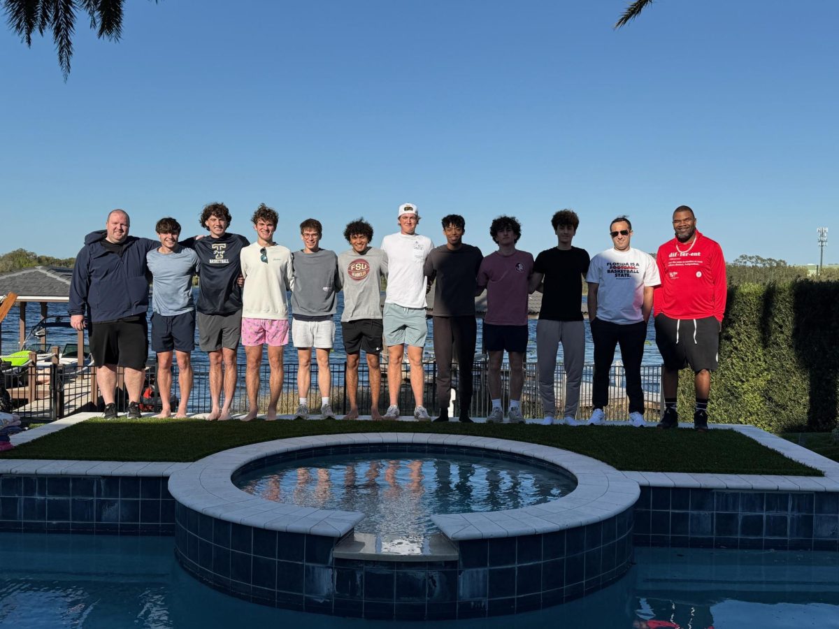 Schneider (far left) poses with his varsity basketball team at their 2025 banquet.
Photo by Eric Schneider, used with permission.