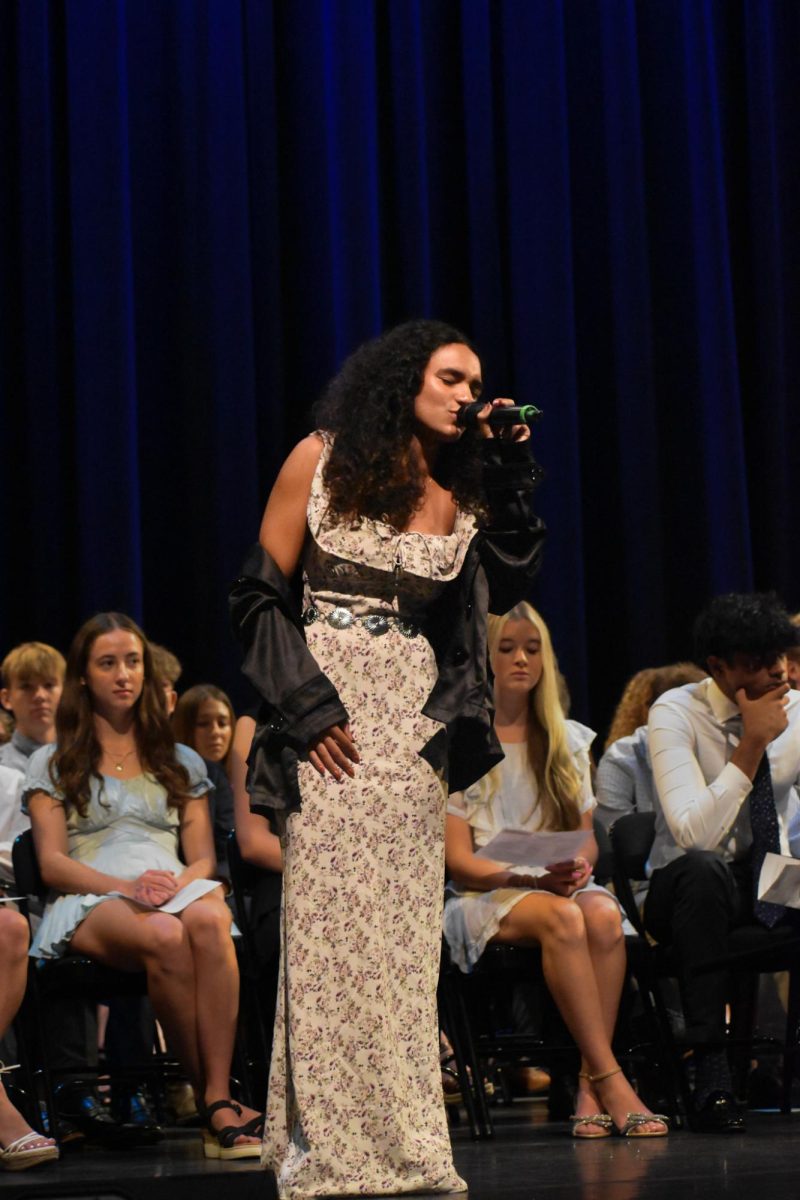 Senior Marisela Morel opens Senior Investiture with a solo performance. Morel is one of the leading members of the Vocal Society.