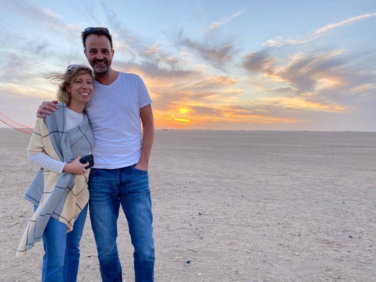 Charlton and his wife enjoying the Kuwait desert and sightseeing during his time teaching abroad.