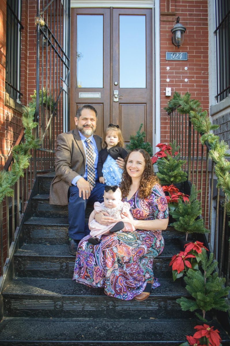 Mary Ann Torrico sits with her family outside her daughters' daycare in DC for a Christmas photo event. Photo by Ann Torrico, used with permission.