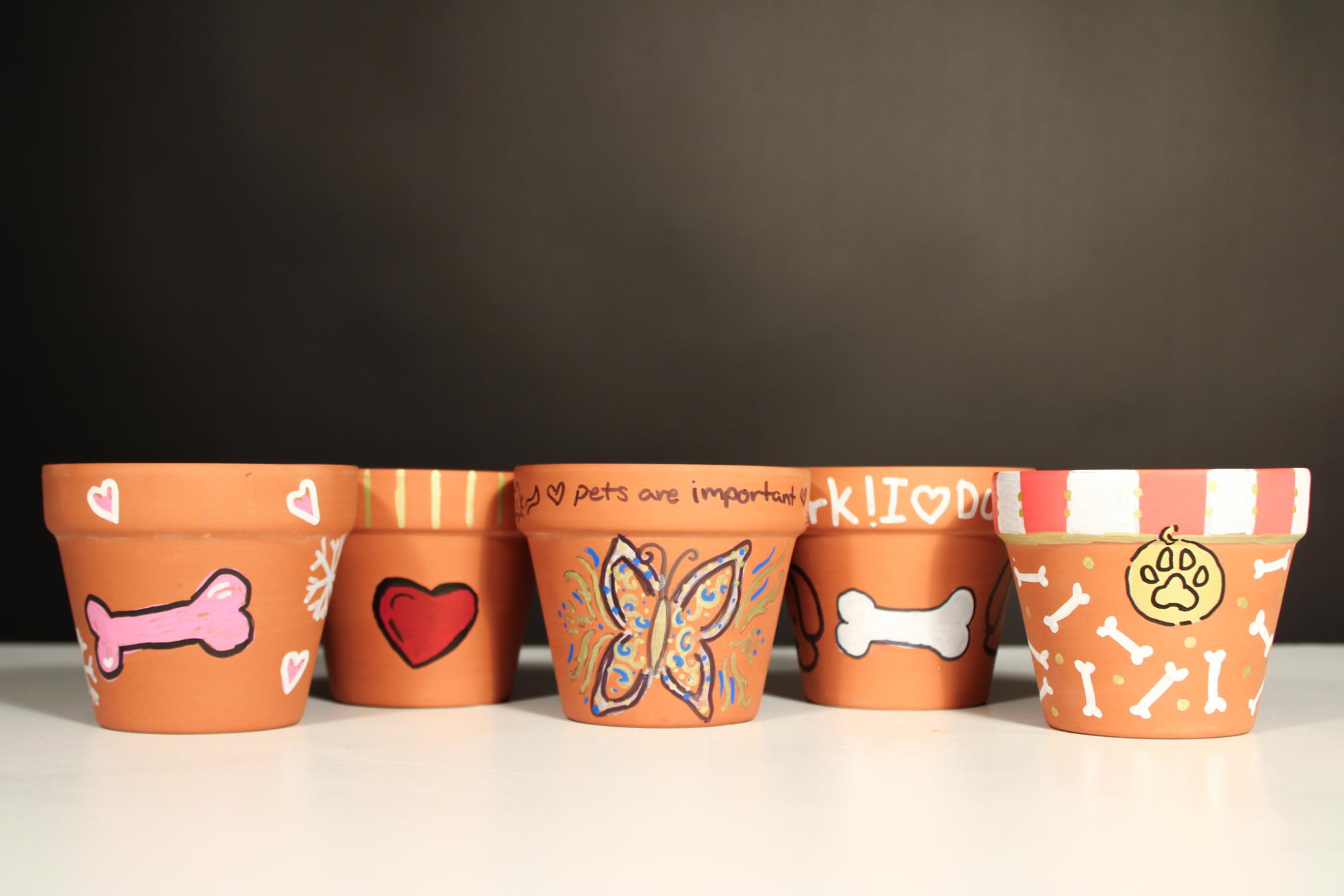 Students designed dog-themed pots for Barktoberfest.