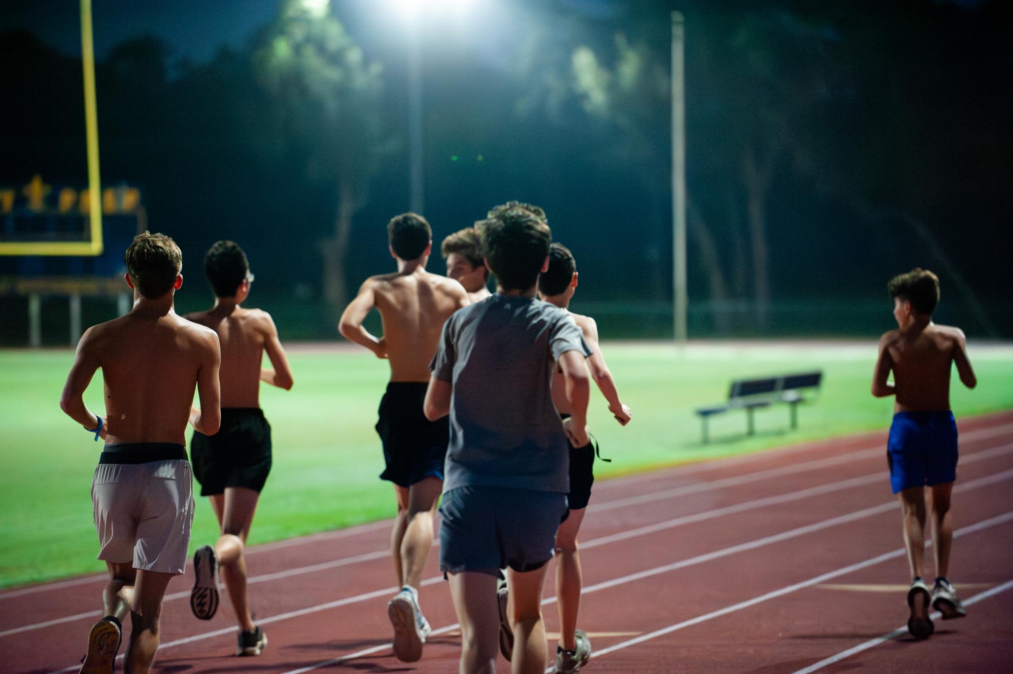 The boys varsity cross country
team runs on the track during
their morning practice, which is
every Monday through Friday
from 6 to 7:30 a.m.