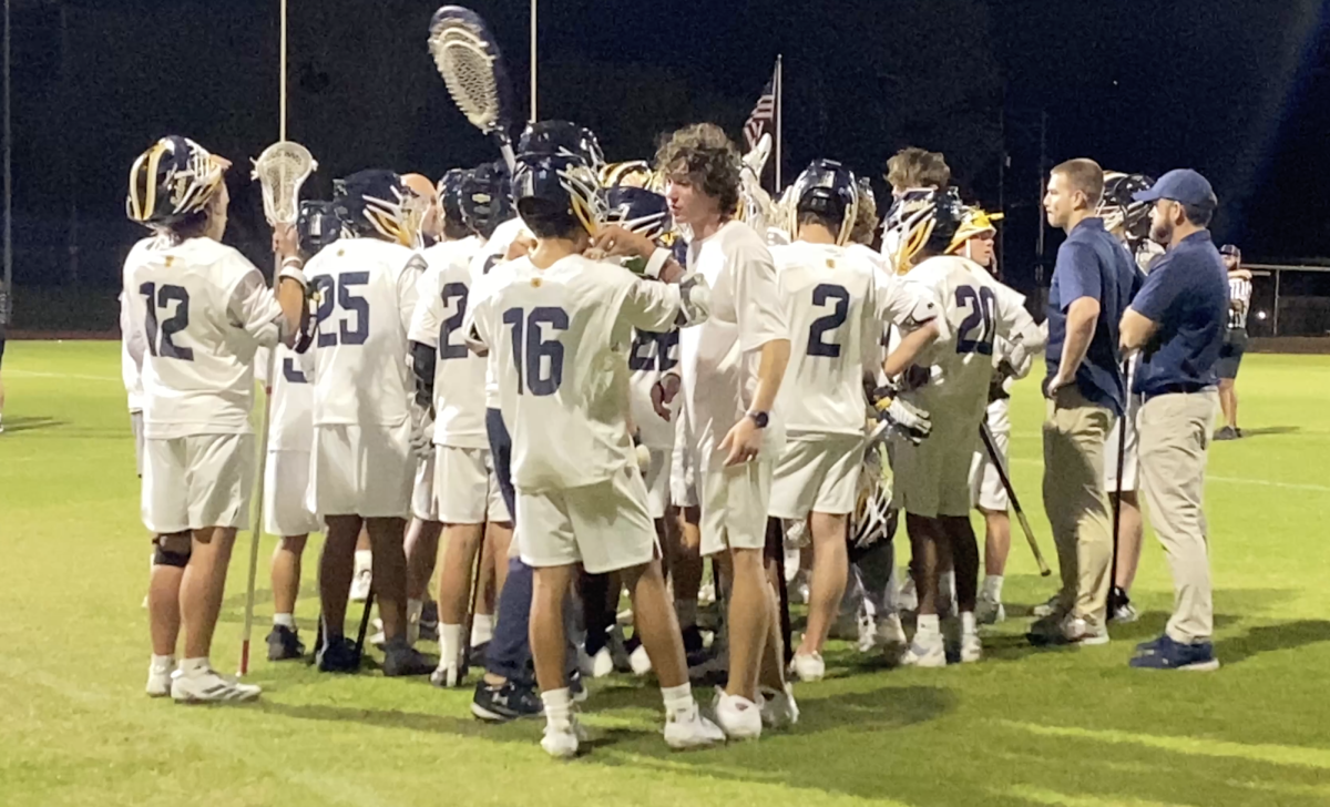The Saints huddle during a timeout.