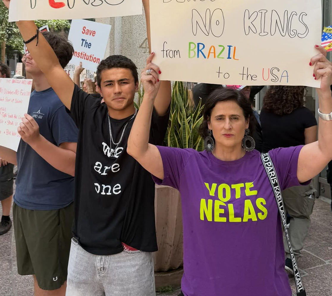 Enzo Kuada ‘29 protests at the No Kings protest in Orlando with his mom, Giselle, on March 28th. Enzo is one of many students who find ways to express their political beliefs even though they cannot yet vote.